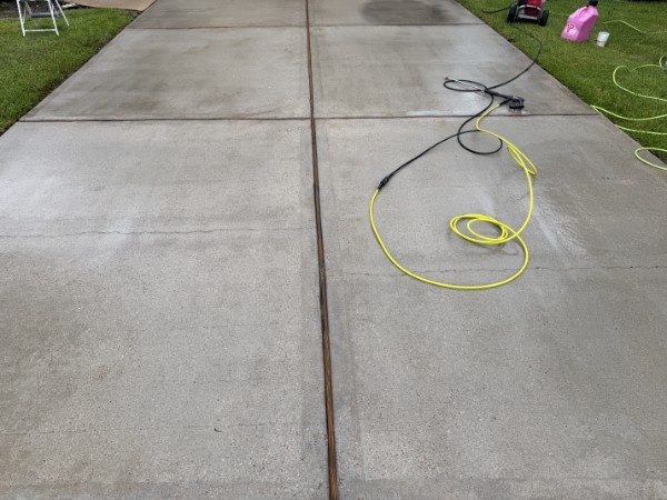 Freshly pressure washed concrete driveway